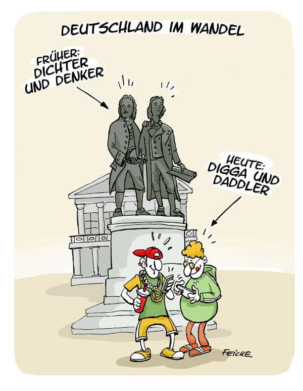 Karikatur: Denkmal mit zwei historischen Statuen, davor zwei Jugendliche in Streetwear mit Handy und Getränk, Überschrift 'Deutschland im Wandel'